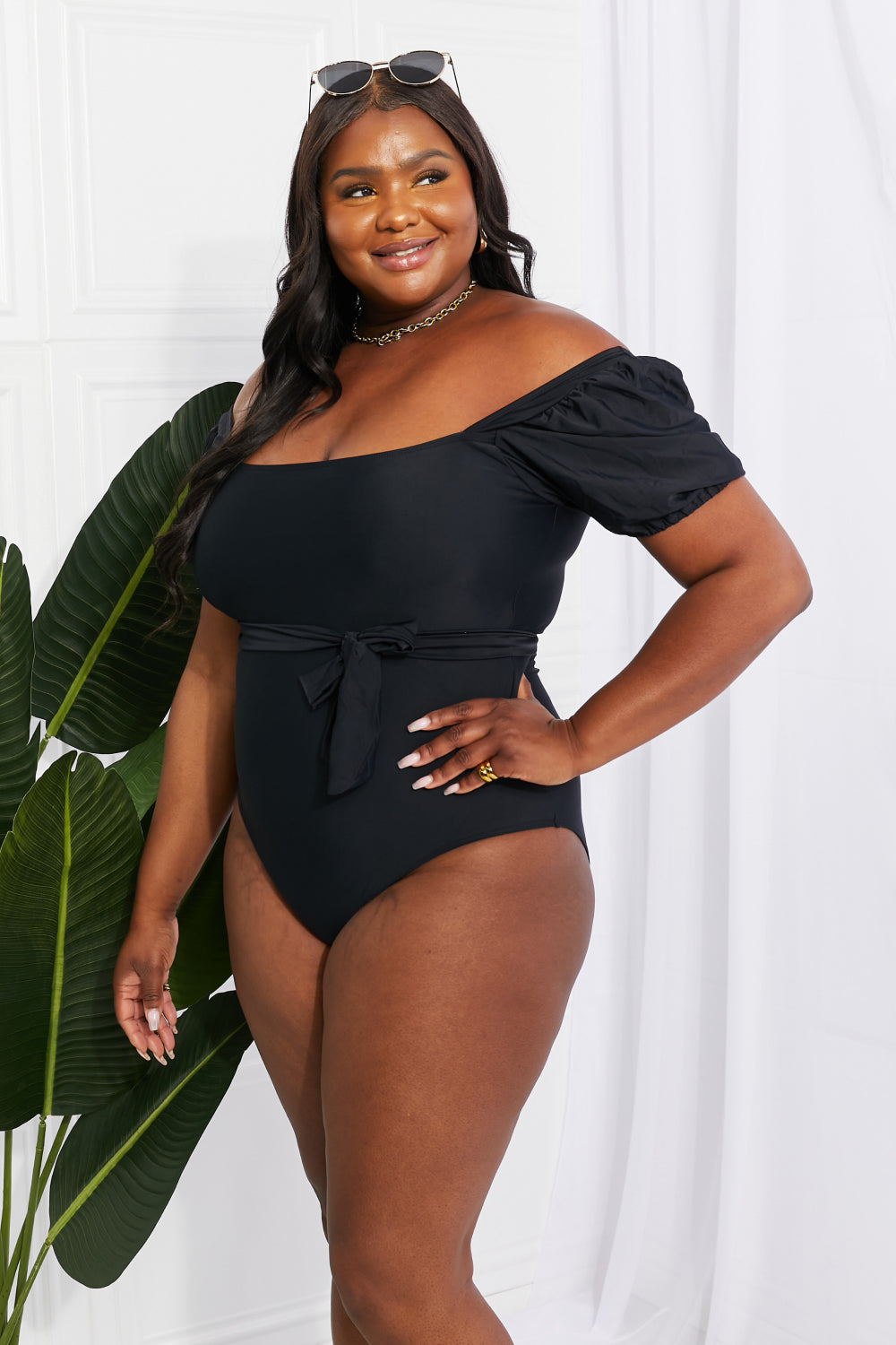 Chic black one-piece swimsuit with puff sleeves