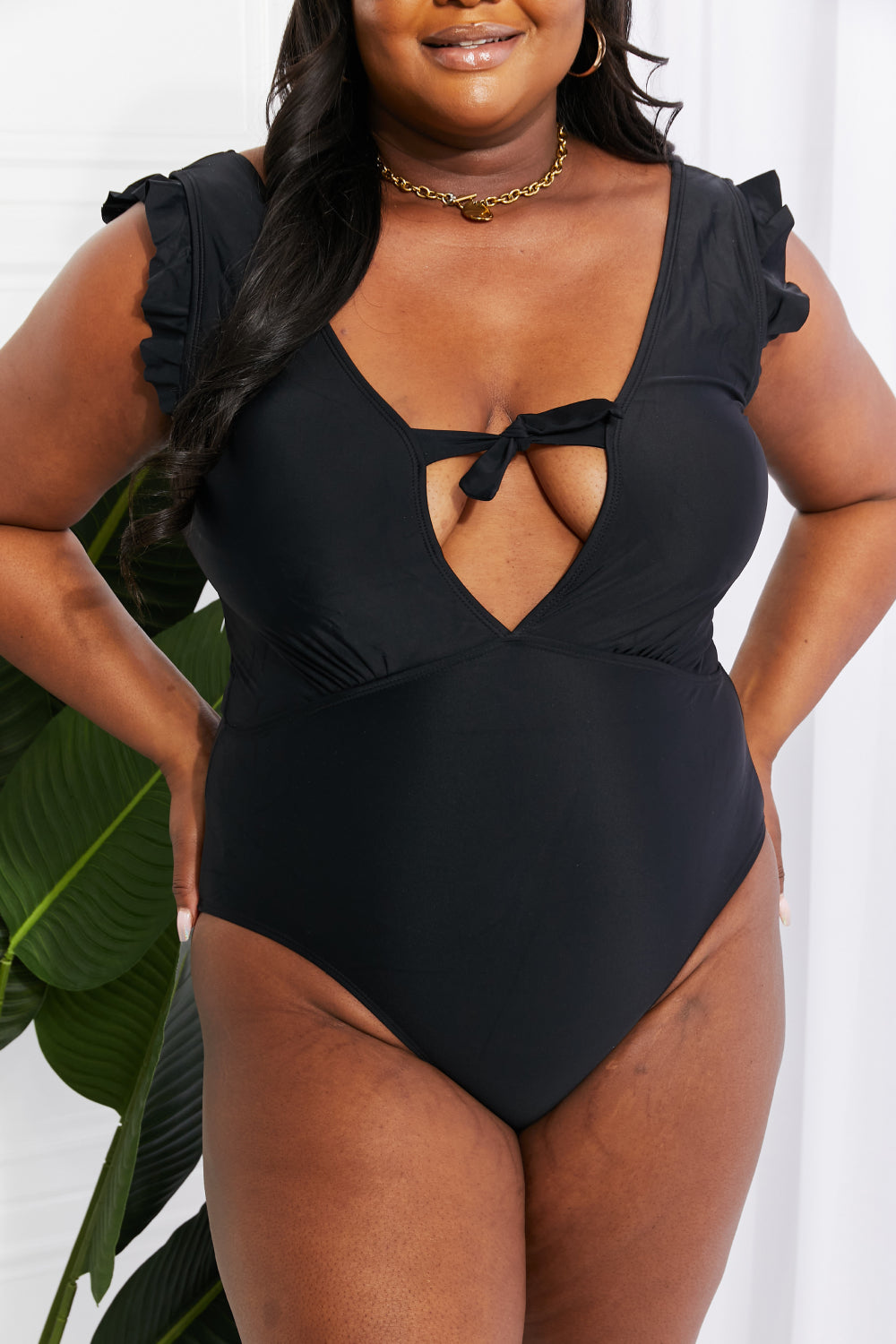 Ruffle sleeve swimwear in black by Marina West Swim