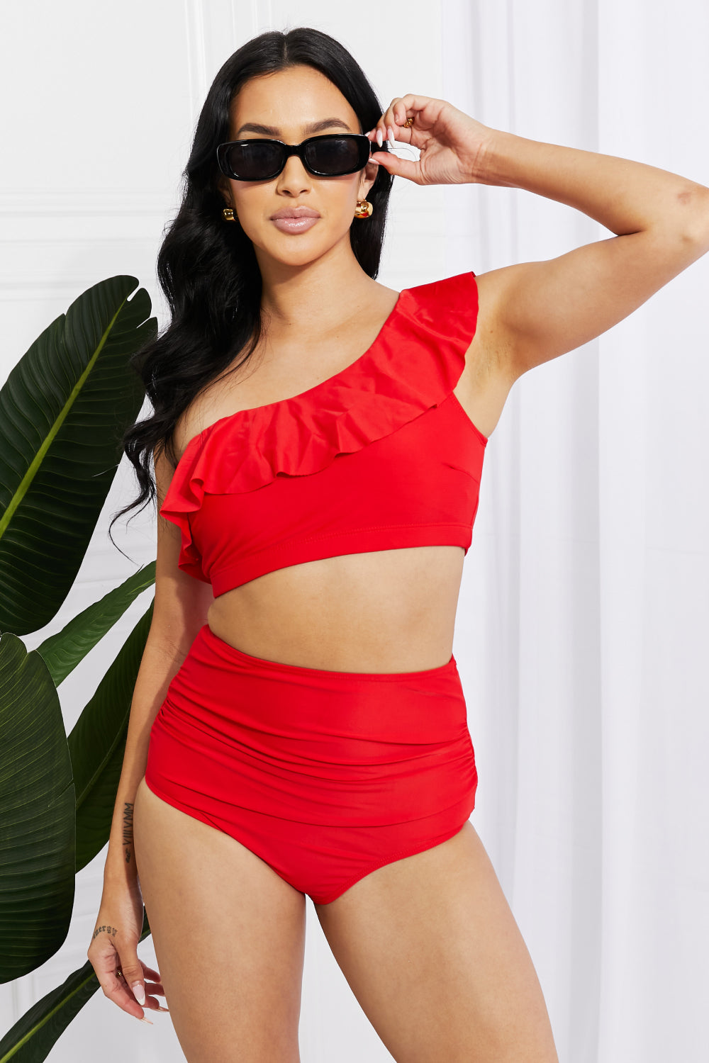 Red beachwear with romantic ruffle accents